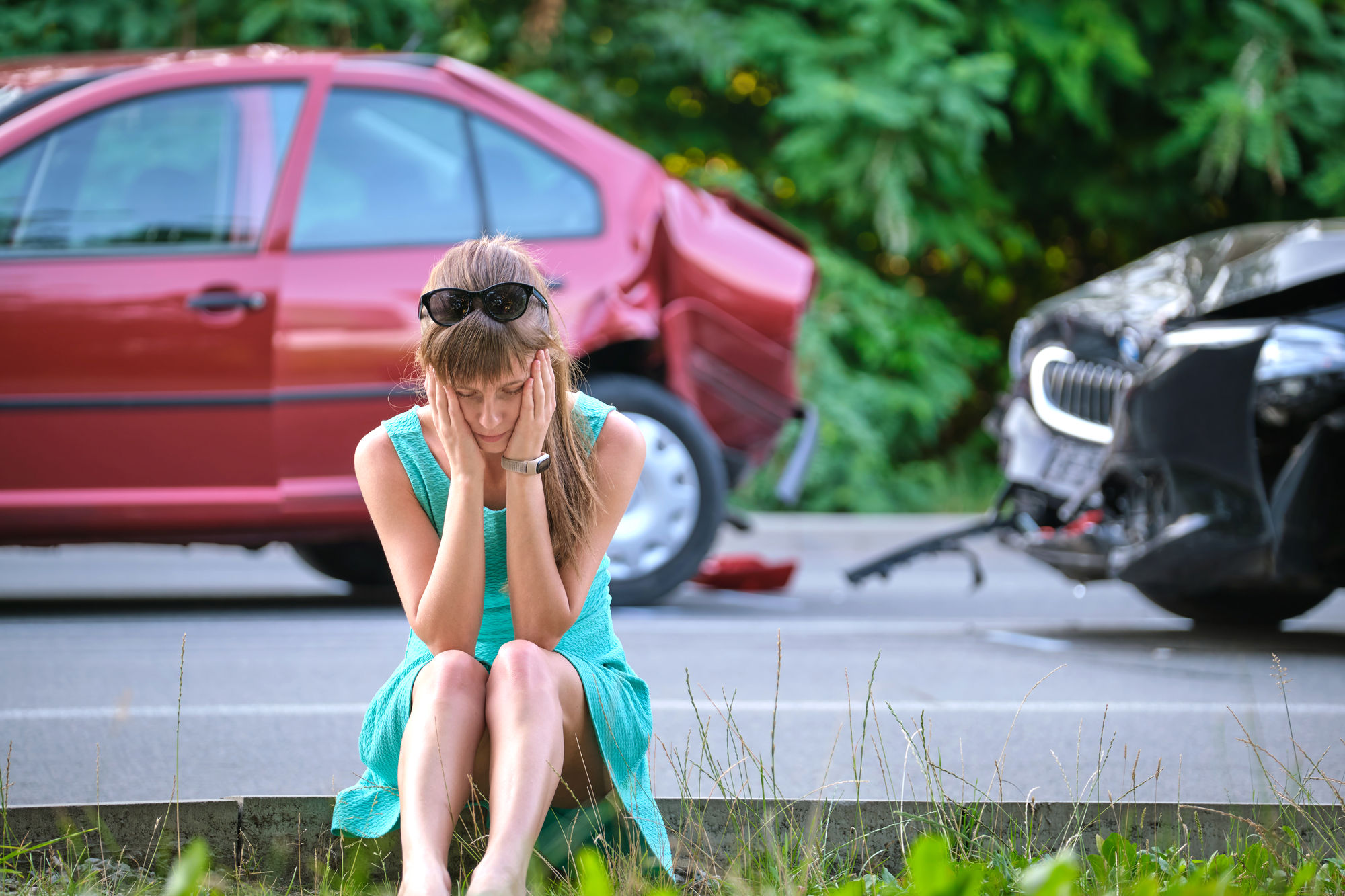 Person distraught after being rear ended in a car